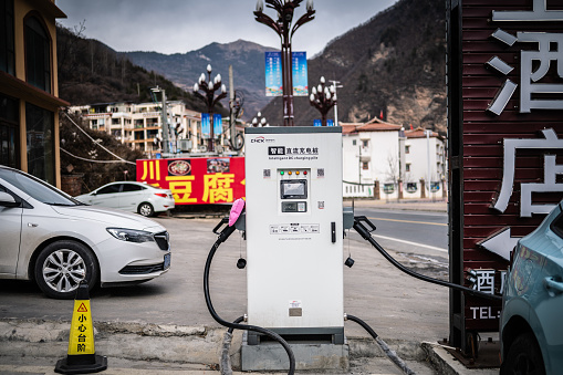 Electric vehicle charging points are located outside cities in the countryside. of Chengdu, China, January 1, 2024