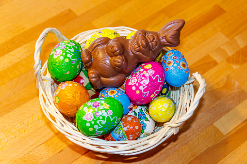 close-up of multi colored easter\neggs in bowl