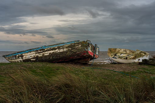 Two shipwrecks on the beach in Sizewell, Suffolk, England, UK