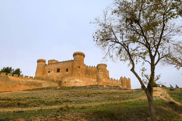 La Calahorra, Spsain - May 25, 2009: View of the castle (Castillo de La Calahorra) with the snow capped mountains of the Sierra Nevada to the rear La Calahorra, Granada Province, Costa Almeria, Andalusia, Spain, Western Europe.