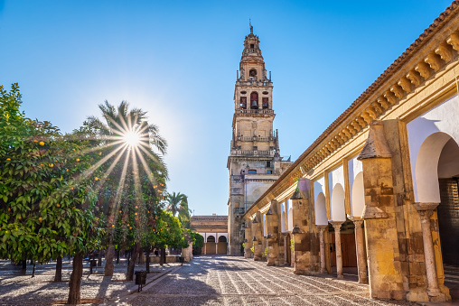 Sunset at the Mosque Cathedral's Bell Tower from Orange Tree Courtyard in Cordoba, Spain
