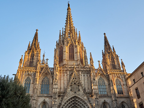 Facade of the Cathedral of the Holy Cross and Saint Eulalia (Catedral de la Santa Creu i Santa Eulàlia in Catalan), also known as Barcelona Cathedral, at sunset. Gothic Quarter, Barcelona, Spain, Europe