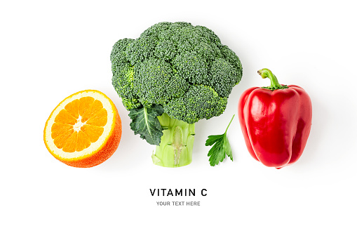 Immunity booster. Broccoli, red pepper, orange citrus fruit, parsley isolated on white background. Healing food collection. Creative layout. Flat lay, top view. Design element. Vitamin C
