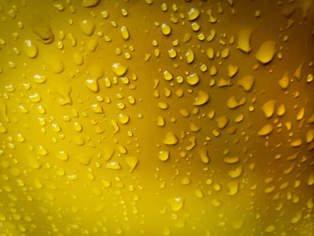 Raindrops on yellow background. Gives a refreshing feeling.