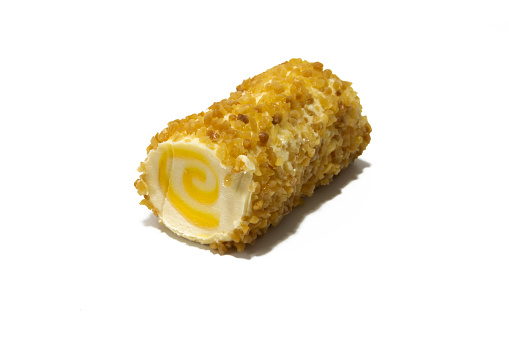 A fruity cheese roll with pineapple and topped with almonds, isolated on a white background. Concept of innovation in food.