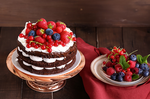 chocolate whoopie pie cake with buttercream and berries