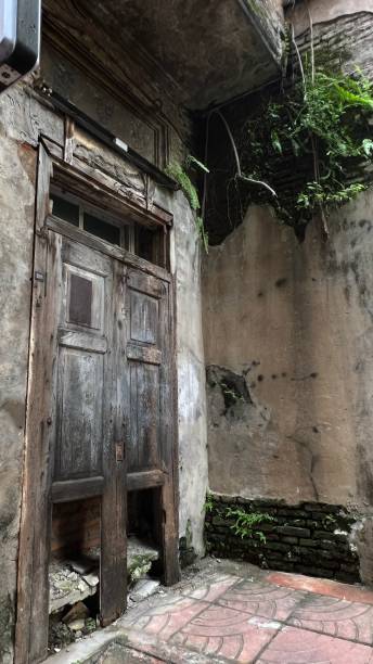 istock Front old  door of an abandoned house. 1967359819