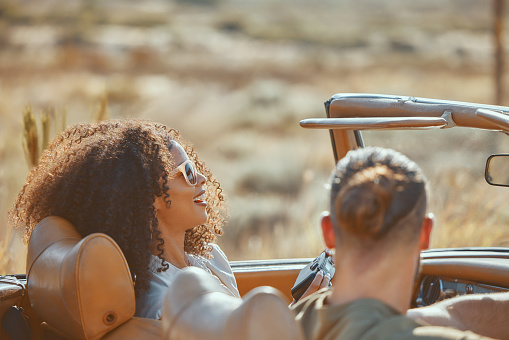 Car, back view or happy couple on road trip on holiday together with love, care and adventure. Laughing, interracial or people in countryside or motor transport for vacation for freedom or honeymoon