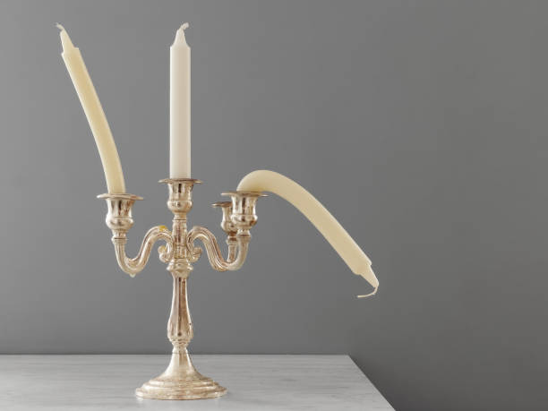 istock Candlestick with straight and bent candles. 1967478550
