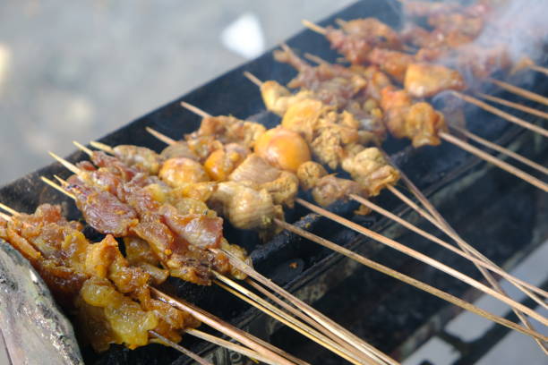istock Sate Ambal is a chicken satay typical of the Kebumen area of Central Java. This satay is made from chicken meat seasoned with spices. Sate is cooked by grilling on a charcoal grill. Indonesian food. 1967483337