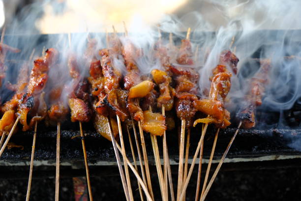 istock Sate Ambal is a chicken satay typical of the Kebumen area of Central Java. This satay is made from chicken meat seasoned with spices. Sate is cooked by grilling on a charcoal grill. Indonesian food. 1967487002