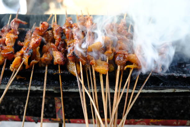 istock Sate Ambal is a chicken satay typical of the Kebumen area of Central Java. This satay is made from chicken meat seasoned with spices. Sate is cooked by grilling on a charcoal grill. Indonesian food. 1967487009