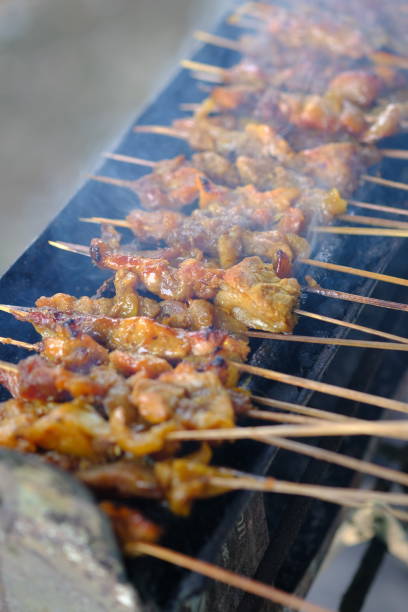 istock Sate Ambal is a chicken satay typical of the Kebumen area of Central Java. This satay is made from chicken meat seasoned with spices. Sate is cooked by grilling on a charcoal grill. Indonesian food. 1967493374