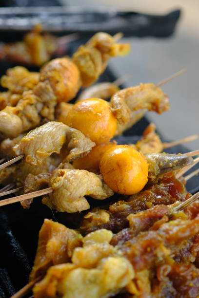 istock Sate Ambal is a chicken satay typical of the Kebumen area of Central Java. This satay is made from chicken meat seasoned with spices. Sate is cooked by grilling on a charcoal grill. Indonesian food. 1967493382
