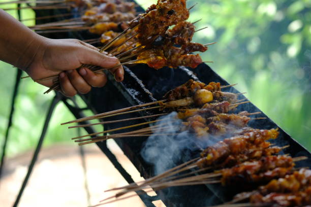 istock Sate Ambal is a chicken satay typical of the Kebumen area of Central Java. This satay is made from chicken meat seasoned with spices. Sate is cooked by grilling on a charcoal grill. Indonesian food. 1967493396
