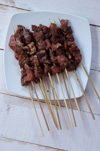 Sate Kambing is lamb satay. This satay is made from lamb meat seasoned with spices. Sate is cooked by grilling on a charcoal grill. Indonesian food.