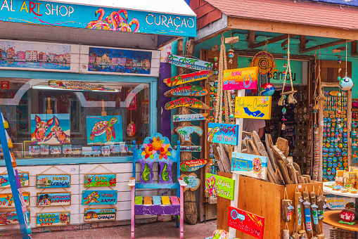 Willemstad. Curacao. 01.28.2024. Colorful souvenir shops lining Willemstad's central street in Curacao, offering a vibrant array of island-inspired treasures.