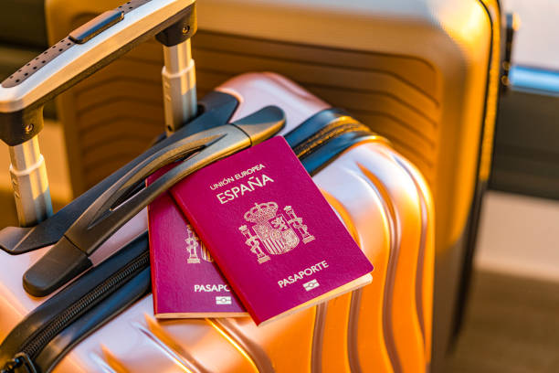 istock Two Spanish passports on suitcase in hotel room 1967522223