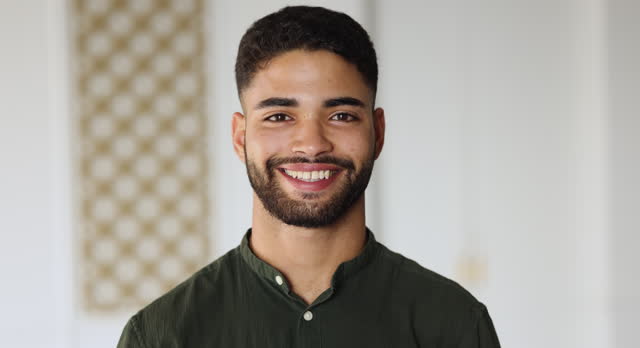 Headshot portrait Moroccan man in casual shirt looking at camera