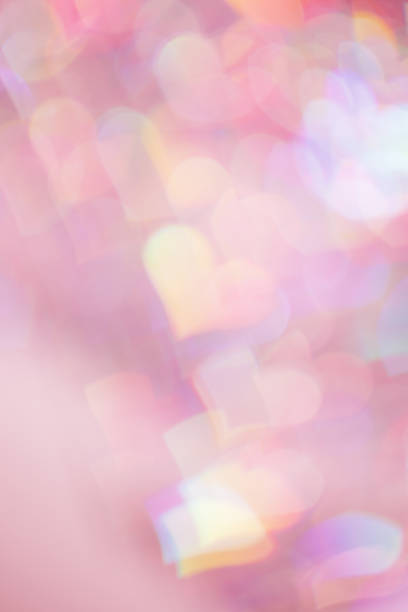 istock Defocused abstract bokeh background with pink pastel colored hearts, flare from lights, blurred bokeh holiday, celebration wallpaper. love and romance aesthetic photo, glittering lights pattern 1967533613