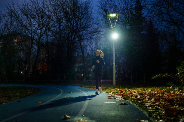 istock Running under the rain in running track 1967536148