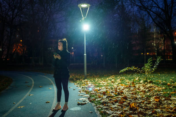 Part of a series of a woman doing exercises in a public park during winter.