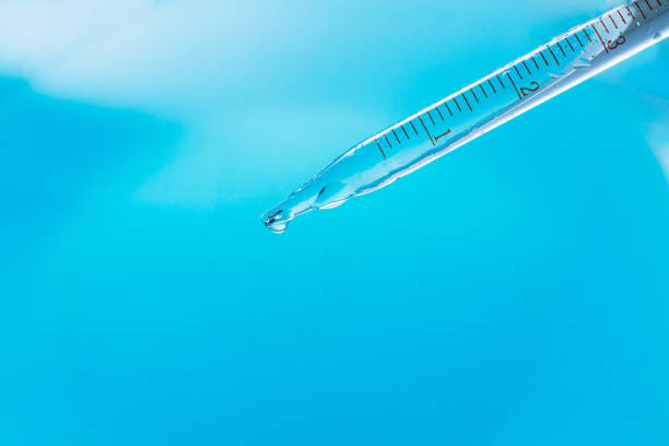 istock Blue macro science experiment beaker,Chemical Test Tube . Chemical experiment with Laboratory glass. 1967539219
