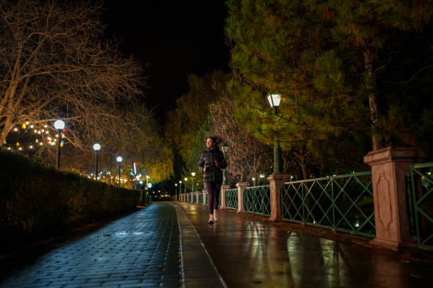 Part of a series of a woman doing exercises in a public park during winter.