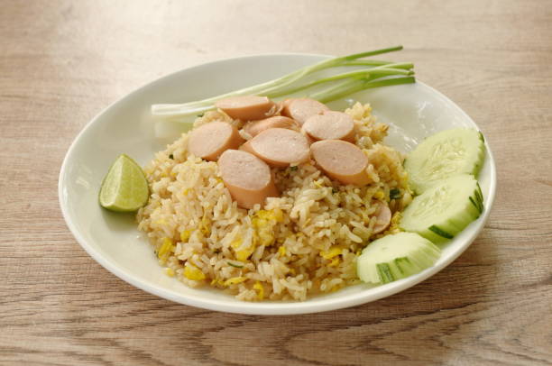 istock fried rice pork sausage and egg with slice cucumber couple lemon 1967543223