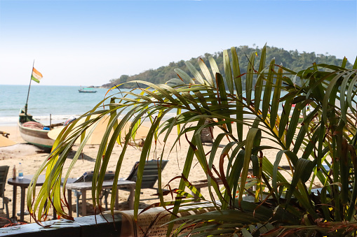 Stock photo showing view from the balcony of a beach hut shack at Palolem Beach, Goa, India.