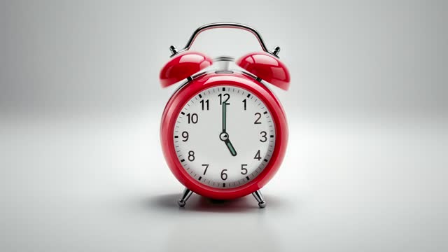 Alarm clock ringing at 5 o'clock. It's ticking quickly  on a white background in the studio lights. The concepts of speed, time, deadline, waking up, stress, bell rings, hour, time lapse, schedule, calendar date, finalize, retro style
