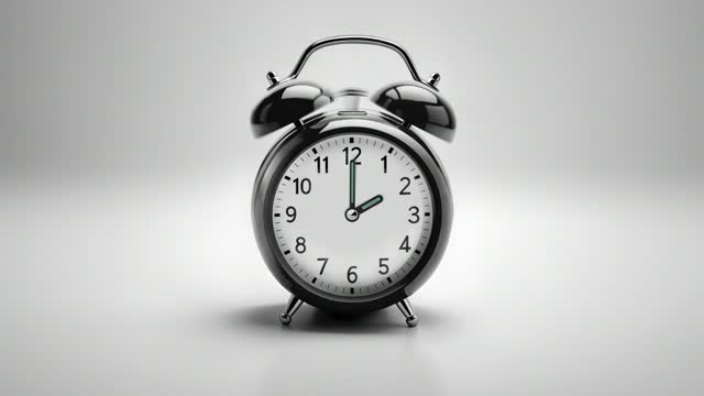 Alarm clock ringing at 2 o'clock. It's ticking quickly  on a white background in the studio lights. The concepts of speed, time, deadline, waking up, stress, bell rings, hour, time lapse, schedule, calendar date, finalize, retro style