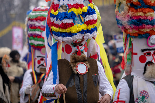 Pernik, Bulgaria - January 27, 2024: 30th anniversary Masquerade festival in Pernik Bulgaria. Men dressed as Kukeri dance and perform a fertility and exorcism ritual.
