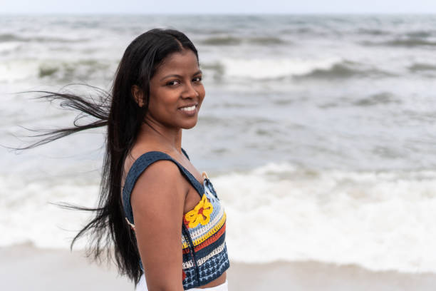 istock Smiling Woman by the Seashore 1967652948