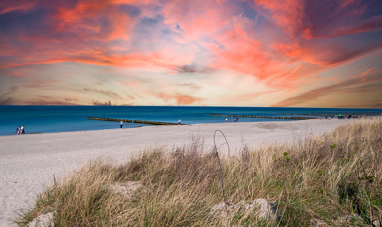 sunset over the beach on the Baltic Sea in Warnemuende, Germany