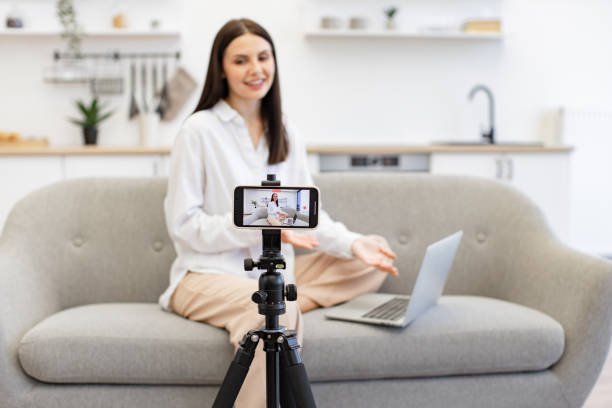 istock Caucasian woman reading information from modern laptop during live broadcast. 1967707165