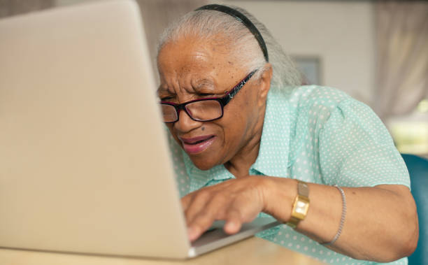 istock Technology, confused old woman with laptop and problem with network, connection or online glitch in home. Computer, email or senior person with glasses, error or internet signal issue on web in house 1967712206
