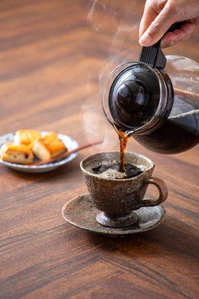 istock Pour hot coffee, steaming hot coffee and biscuits 1967725058