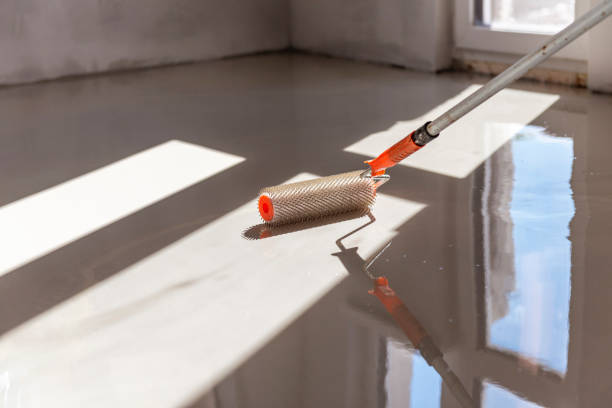 istock Self-leveling epoxy. Leveling with a mixture of cement floors. 1967727718