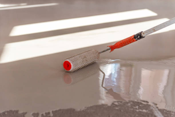 istock Self-leveling epoxy. Leveling with a mixture of cement floors. 1967729368