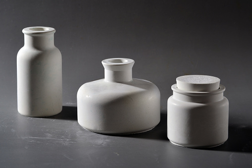 Ceramic vases on a gray background. Studio photography.