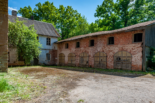 Red brick outbuildings, remains of a destroyed estate. Aumeisteri Manor, Latvia.