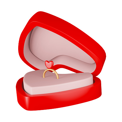a pair of engagement rings placed in red ring container