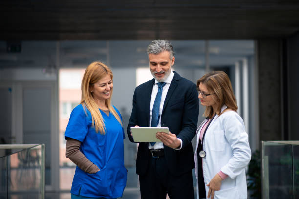 istock Doctors talking to pharmaceutical sales representative, presenting new pharmaceutical product. Hospital manager talking with doctors team. 1967750086