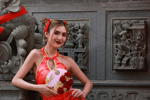 Beautiful young woman wearing Balinese dancer costume