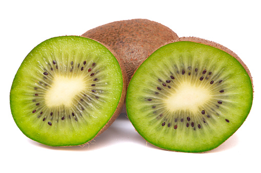 Cut a kiwi in half, showing the flesh and seeds inside. on a white background