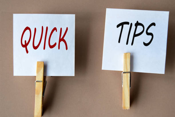 istock QUICK and TIPS - words on white sheets of paper with clothespins on a coffee background 1967833281