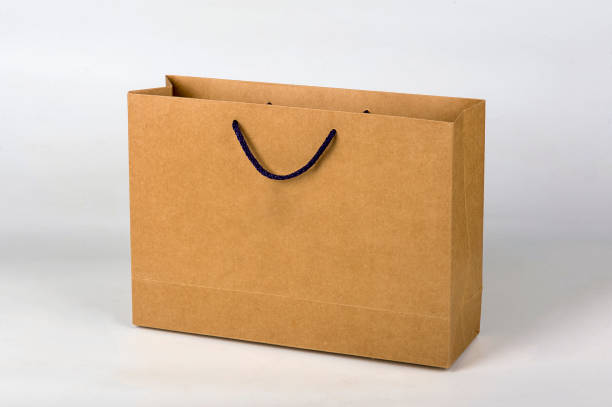 istock Cardboard carrier bag, isolated on white 1967838129