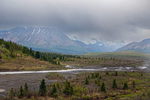 Some low hanging clouds over the mountains in Denali National Park in Alaska.