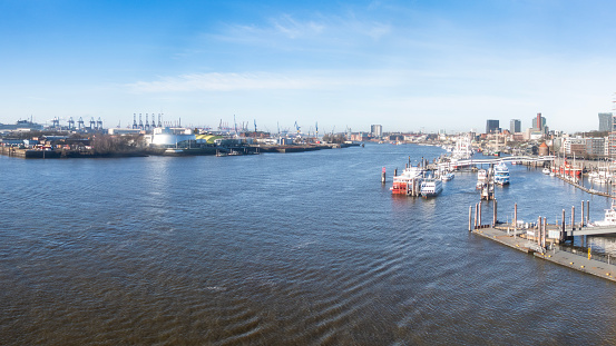 Hamburg, Germany - January 29. 2024: Panoramic shot of the port of Hamburg, perspective in the direction of the river, elevated view